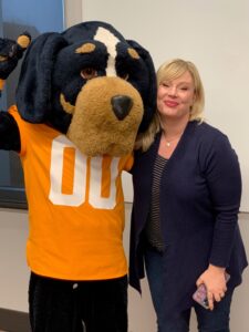 Brook statnding next to Smokey Mascot person